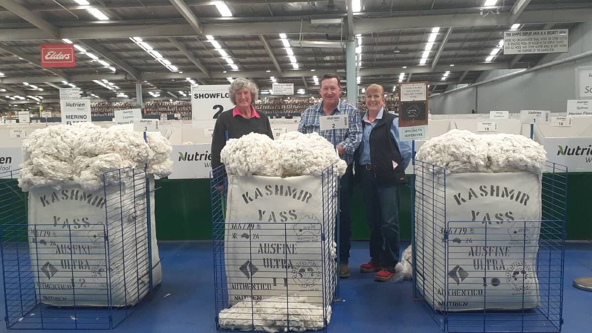 Wool classer Irene Holloway, her brother Neil Carey, Kashmir, Wee Jasper, NSW, and his wife Vicki Bailey with the highest-price 1PP bale for the 2022-2023 season, that sold for 9000 cents a kilogram greasy in September. Picture supplied.