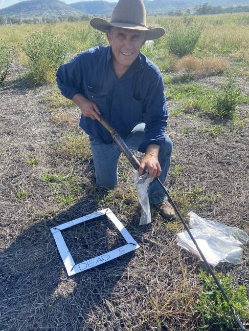 Researcher Shane Campbell collecting a soil sample. 