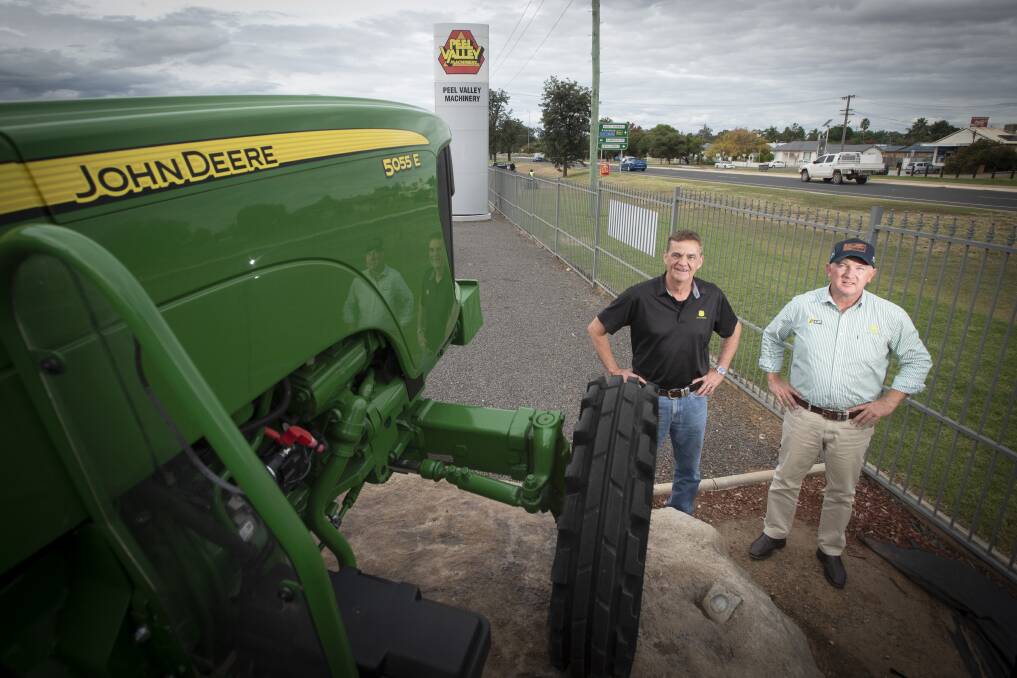 GREEN DEAL: Steve John and Andrew Sands at Peel Valley Group's Tamworth John Deere dealership. The firm's five sites have been sold. Photo: Peter Hardin