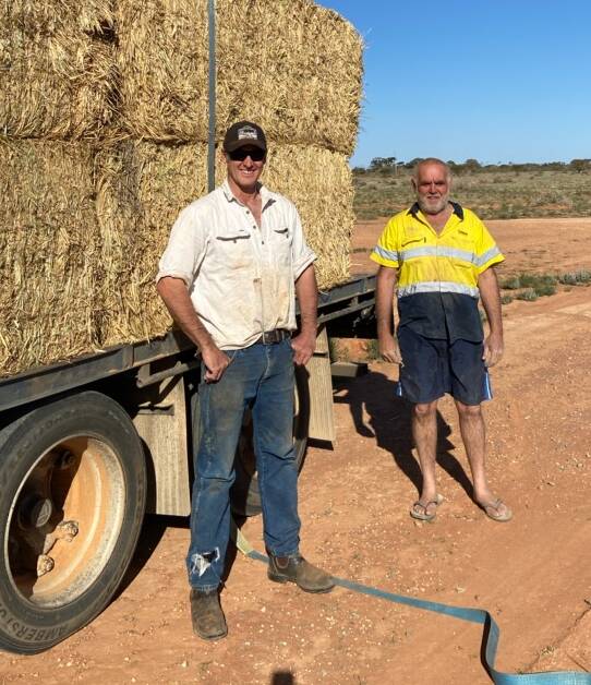 Matt Jackson, PAWD president, during the drought receiving a relief hay delivery.