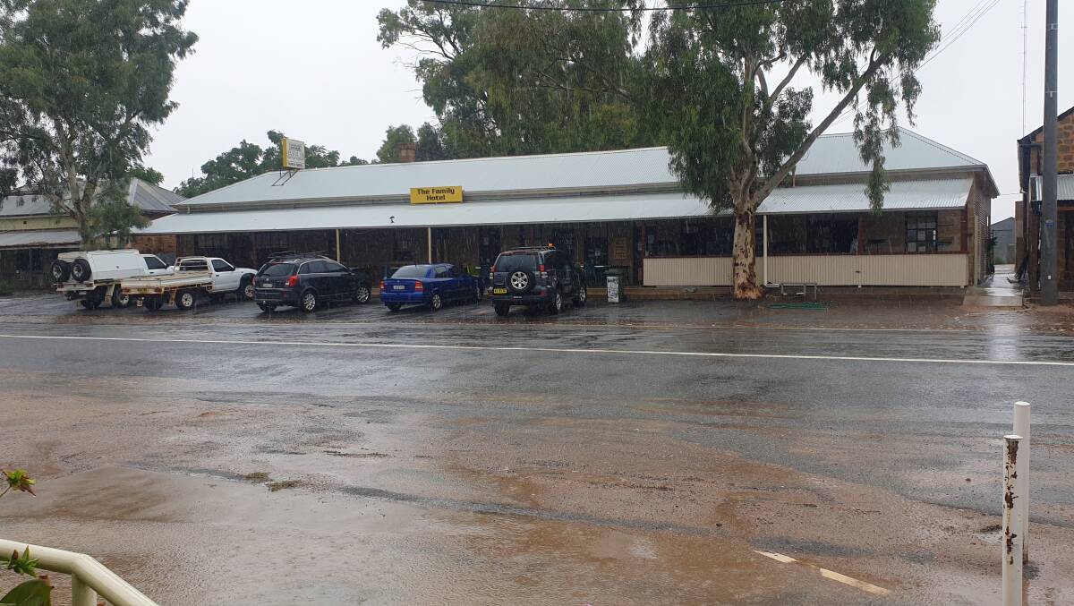 Water fills the street outside the Family Hotel in Tibooburra. Photo courtesy of Michelle, Family Hotel.