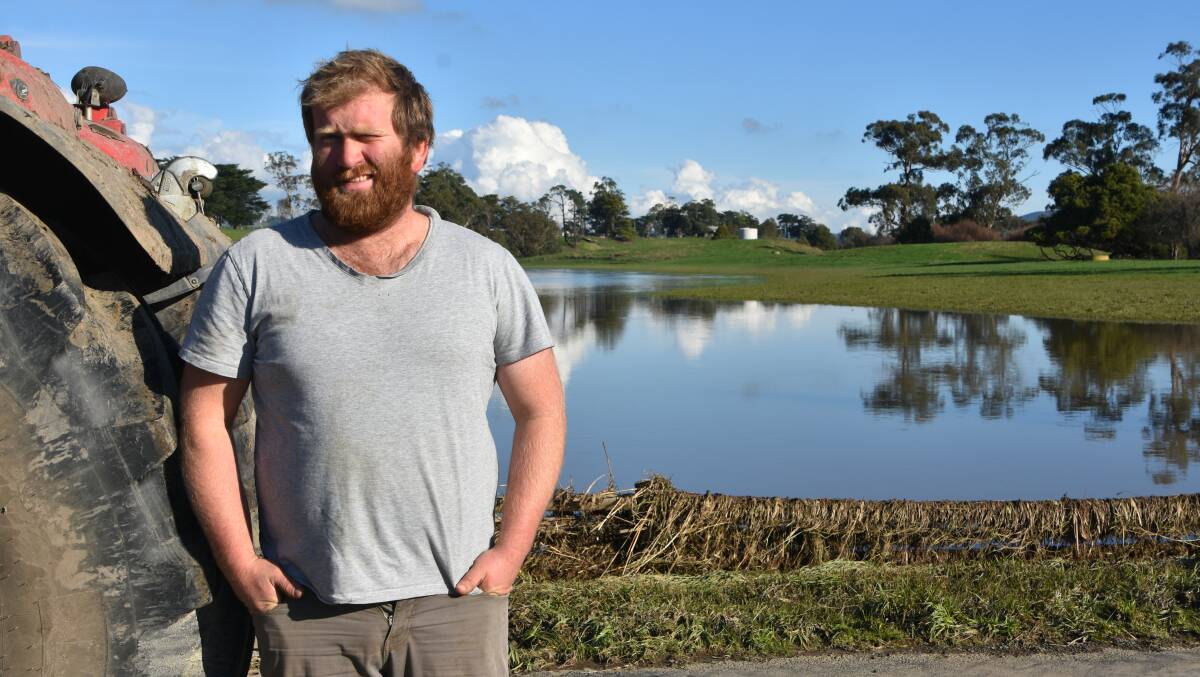 RECOVERY: Yinnar, Vic, dairy farmer Jason Lee stands in front of what would normally be one of his grazing paddocks.