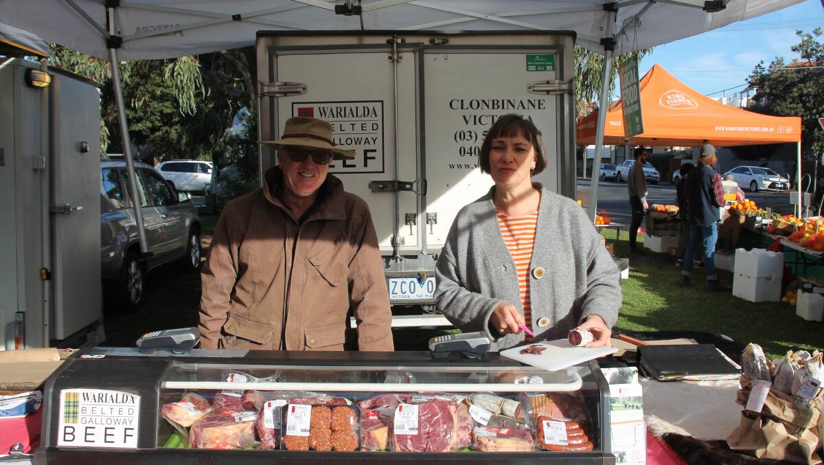 AT THE MARKET: The Snaiths man their store at St Kilda's Peanut Farm Farmers Market in Melbourne.