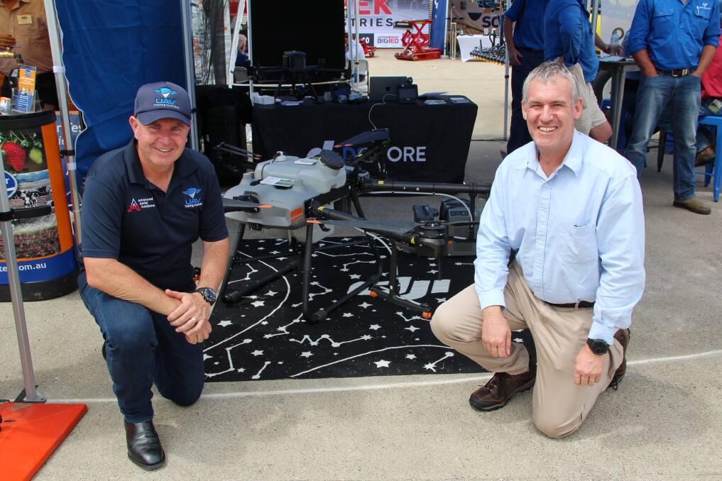 Wayne Condon, Advanced Aerial Solutions, shows Steve Young, Newcastle, NSW, the DJI Agras T30 drone. 