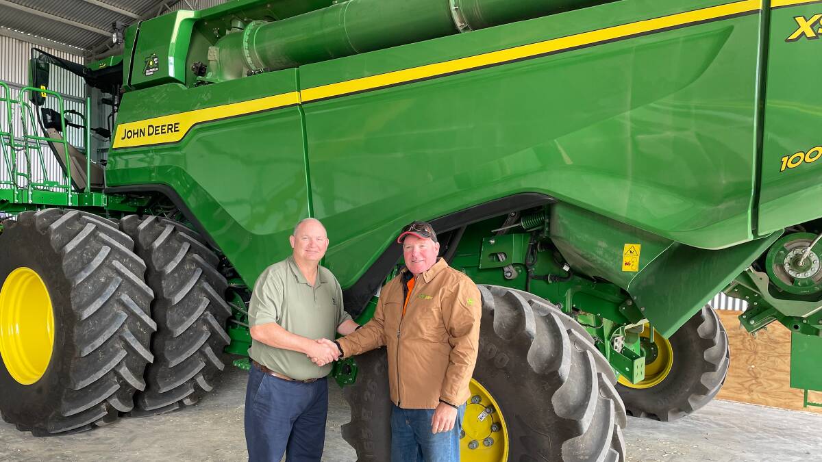 David Mooney from John Deere dealership Pringles Crouch was there to deliver an X9 1000 harvester to Michael Slater, Cummins, South Australia. 