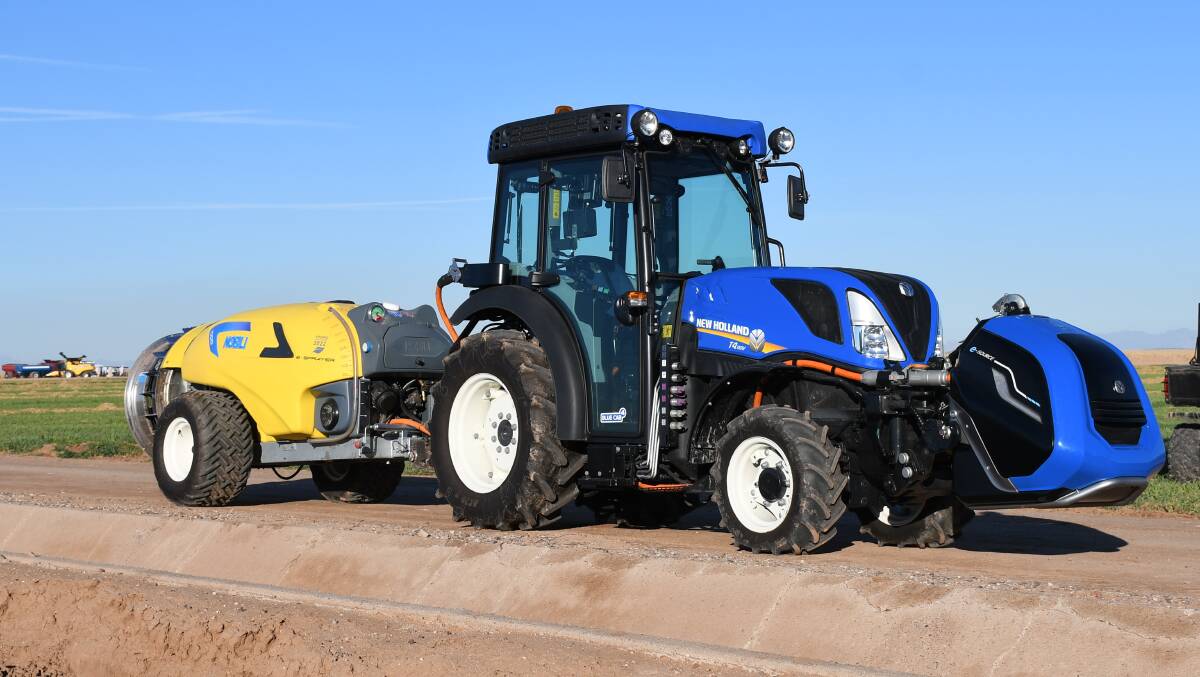 A New Holland T4 tractor fitted with an e-Source power pack and towing a Nobili e-Sprayer. 
