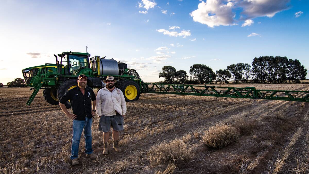 Jake Hamilton, Krui Pastoral, Condamine, with operator Nathan Tidswell in front of the John Deere 616R self-propelled sprayer, which was factory fitted with See & Spray Select.