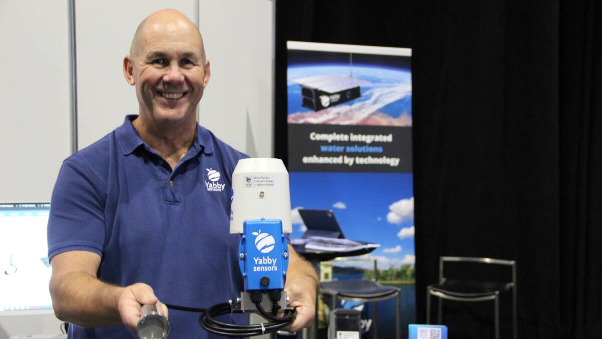AgSmart Expo: Yabby Sensors managing director Steve Dudgeon with a cellular tank monitor and rain gauge. The company also offers a satellite version. 