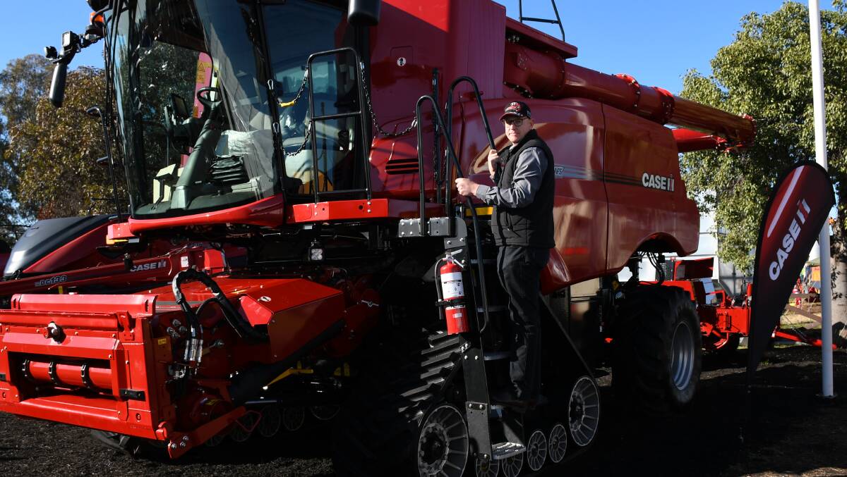 Case IH ANZ hay and harvest product specialist Andrew Wood with the Case IH 8250 harvester. 