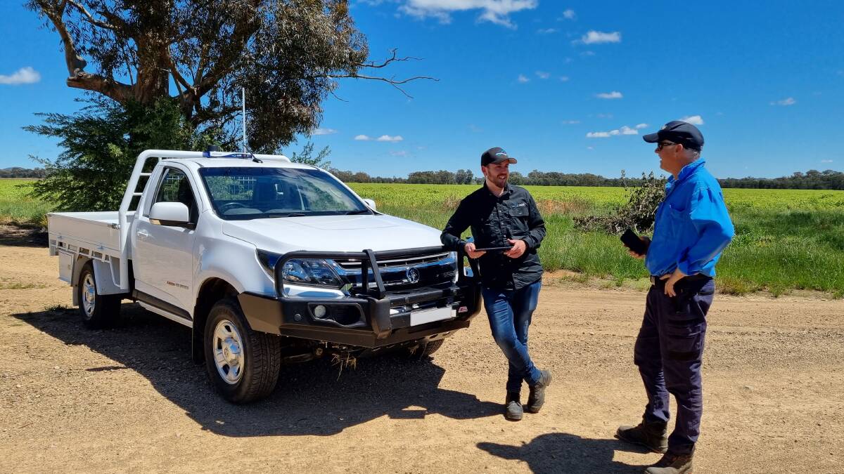 Zetifi project manager Luke Brodrick and farmer Andrew Dumeresq, Gregadoo, NSW, discuss the technology. 