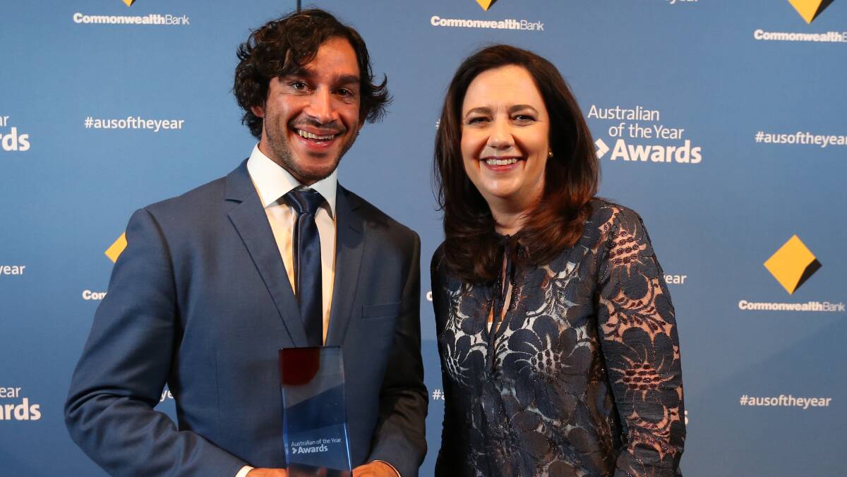 Queensland Australian of the Year winner Johnathan Thurston with Queensland Premier Annastacia Palaszczuk at the awards night at The Old Museum in Brisbane on Wednesday. Photo: AAP/Jono Searle