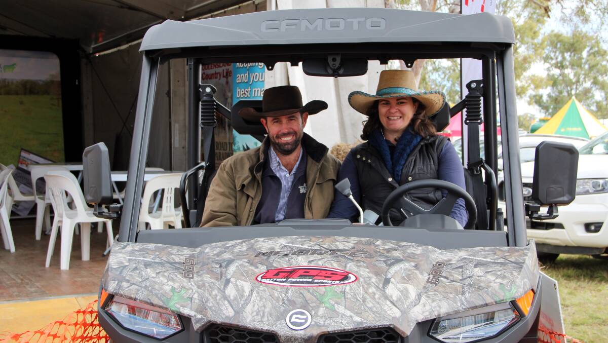 Cameron and Liz Weston, Toogoolawah, Qld, checking out the CFMoto UForce 600 EPS outside the Queensland Country Life stand at Elders FarmFest 2022. 