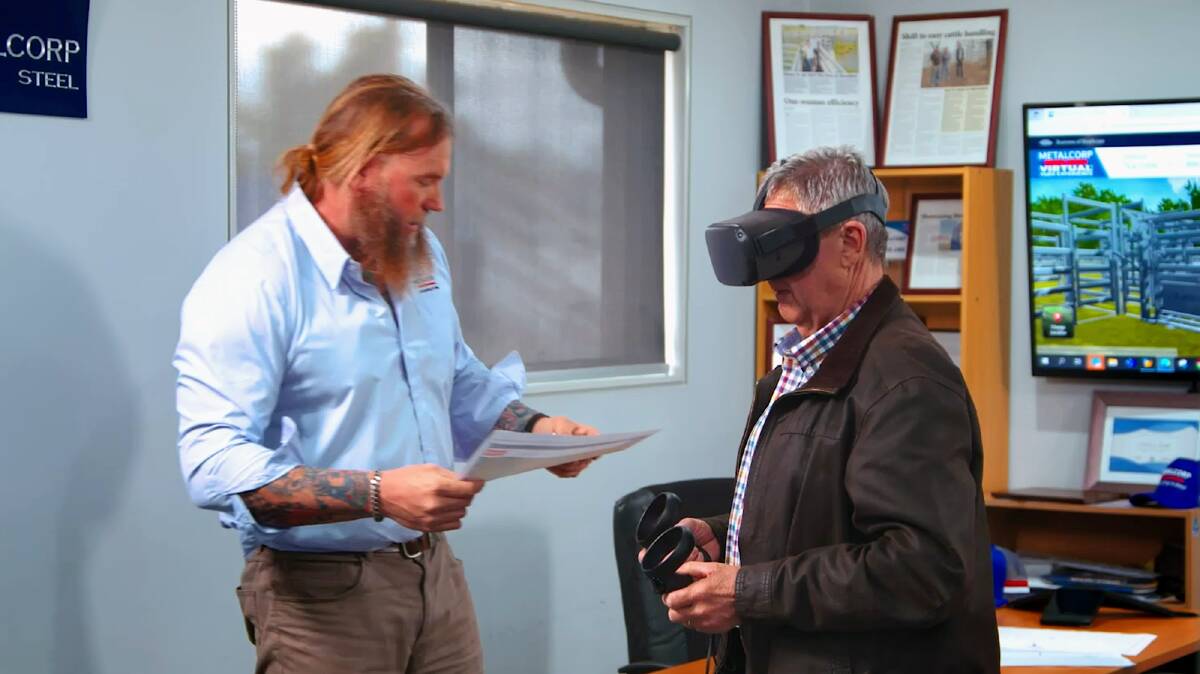 Metalcorp NSW rural manager Tony Fenwick showing a customer a yard design through a VR headset. 