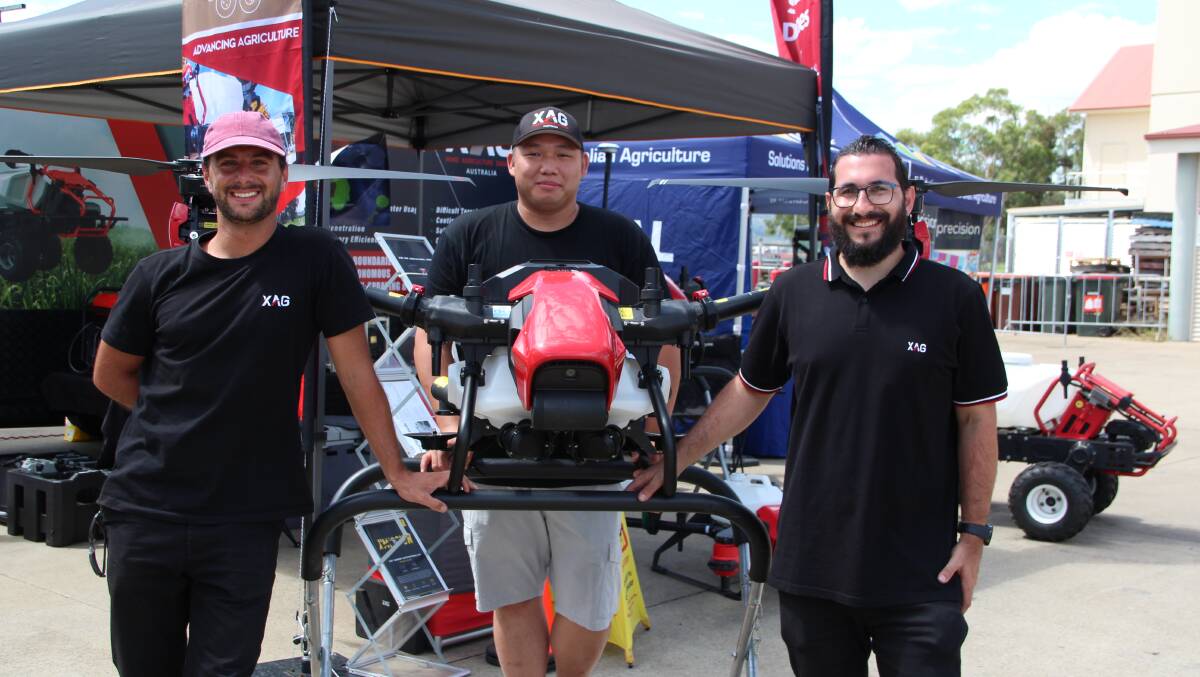 Manning the XAG stand is John Santos, Charles Chow, and Anthony Melita, with the XAG V40 bi-copter.