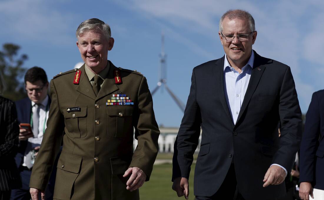 Drought Co-ordinator Major General Stephen Day and Prime Minister Scott Morrison arrive for the National Drought Summit at Old Parliament House, Canberra, in October last year. Photo: Alex Ellinghausen.