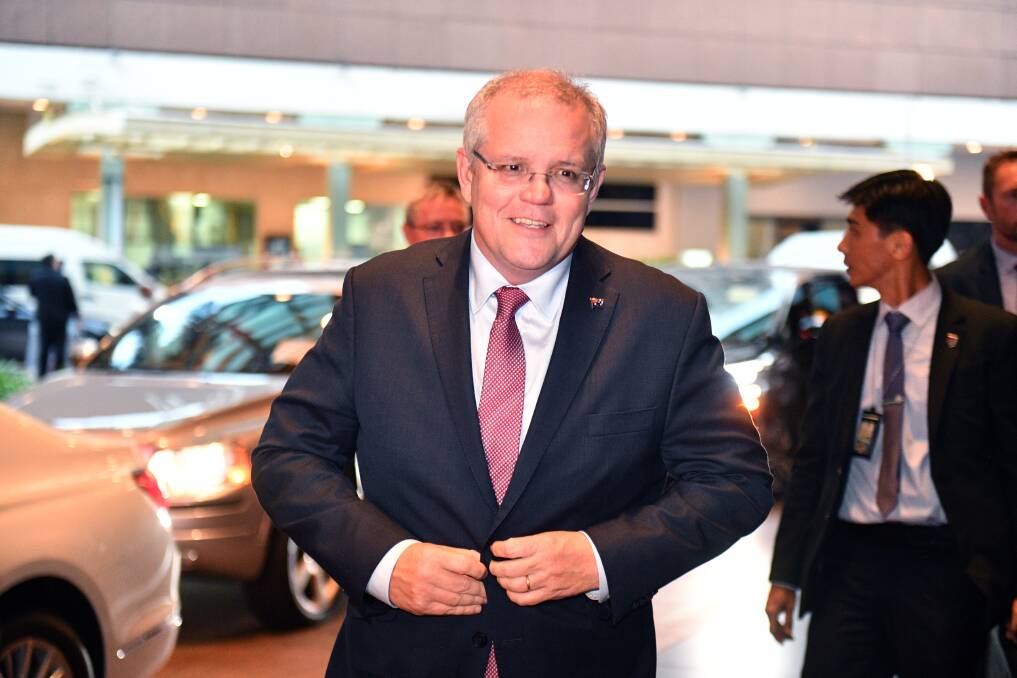 balancing act: Prime Minister Scott Morrison arrives ahead of the ASEAN Summit in Singapore on Tuesday. Photo by Mick Tsikas.