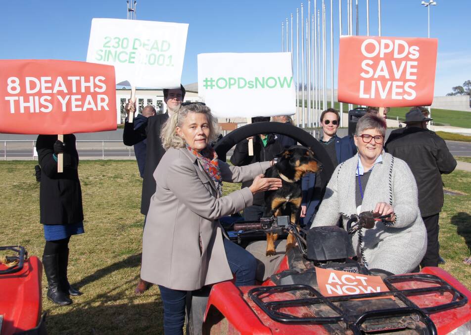 Dog whistle: National Farmers' Federation president Fiona Simson and Country Womens' Association of Australia Tanya Cameron with Slim on the front lawns of Parliament House.