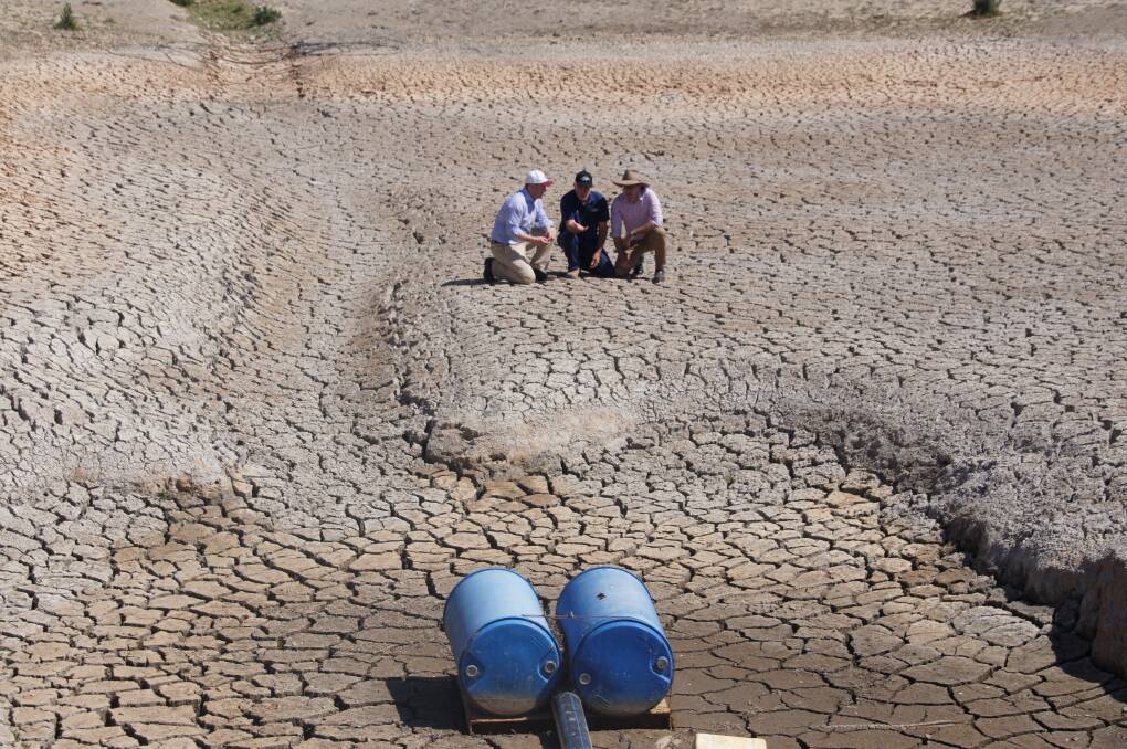 Treasurer Josh Frydenberg, StanthorpE, QLD apple grower Dino Rizzato, and Drought Minister David Littleproud in the desperately dry Granite Belt on Friday.