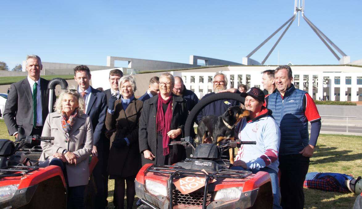 Rural groups, politicians and Slim the dog campaigned for mandatory roll-over protection on the lawns of Parliament House this week.