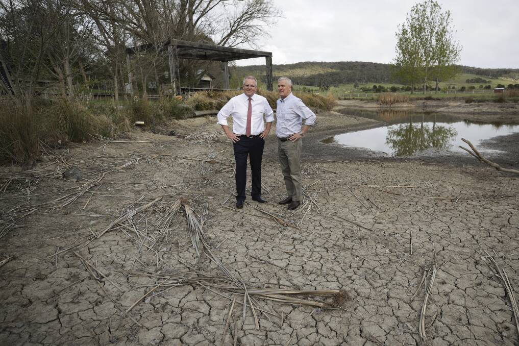 Nationwide reform needed: Prime Minister Scott Morrison and Deputy Prime Minister Michael McCormack discuss the drought at a farm near Canberra, at Mulloon, NSW. Photo by Alex Ellinghausen.