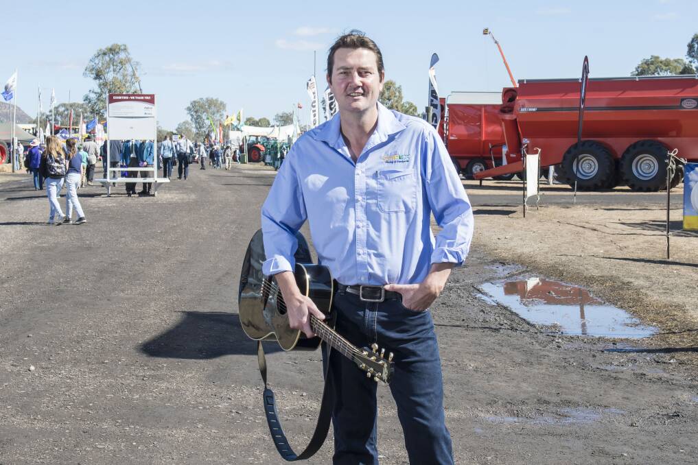 LIVE: Country music singer Adam Harvey dropped into AgQuip 2018 to perform for the crowds and encourage farmers to seek drought relief. Photo: Peter Hardin