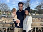 SHEEP SALE: Luke McSwain holding Chase with partner Ella Smith, Merbein South, at the fortnightly Ouyen sheep market last week.