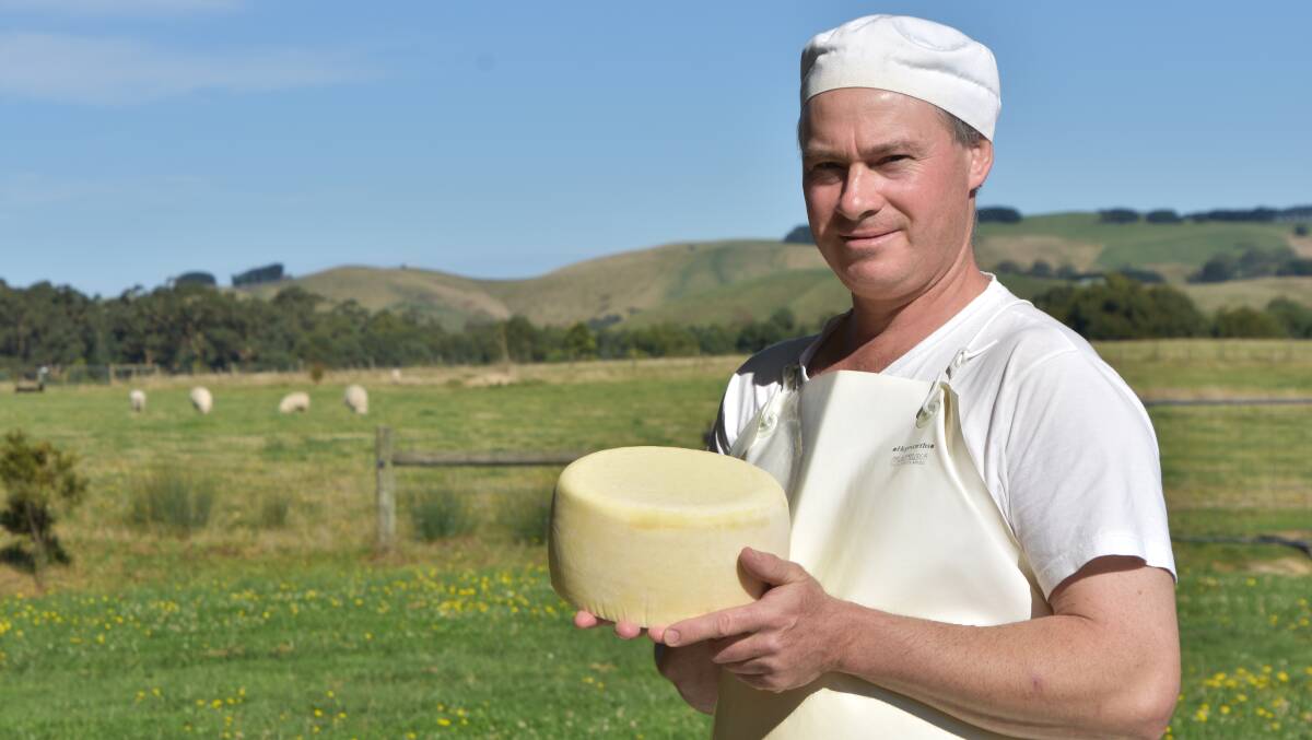 THE RAW TRUTH: Prom Country Cheese owner and cheesemaker Burke Brandon shows off one of the first commercial raw milk cheeses to be made in Victoria.
