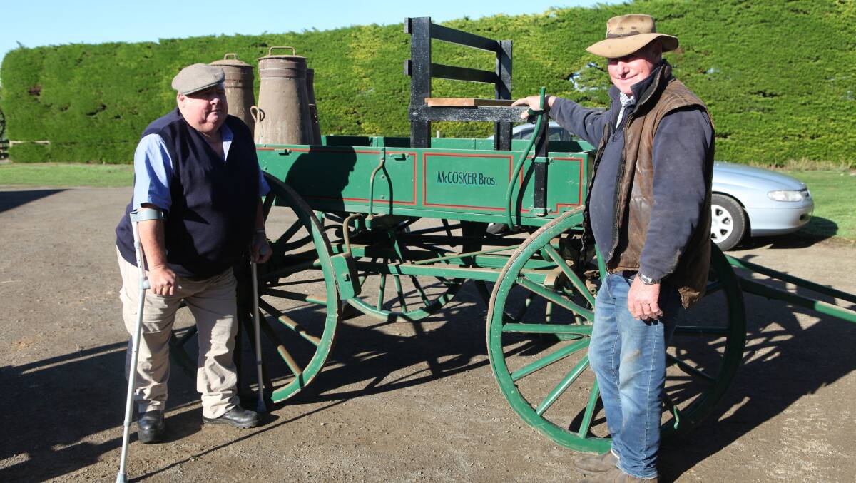 HISTORY: Norm McCosker, Illowa (right), with brother Billy stand in front of a wagonette, identical to the cart the pair's parents used to transport milk in cans to the Dennington factory. Photo by Rachael Houlihan.