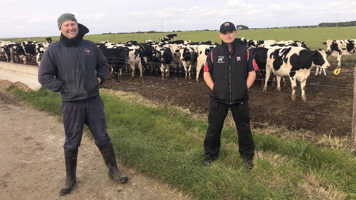 Breed advisor, Matt Aikenhead (right) used the Genetic Futures Report to show Travis Telford how much more income high BPI cows contribute to the business. Photo by
Trevor Telford.