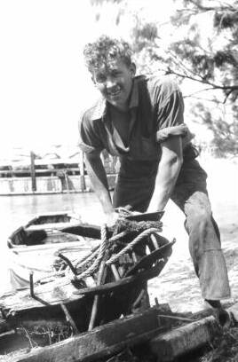 Peter Grundy tying off the pram to the PS Wilcannia rudder. Parts of the PS Wilcannia now form part of Mundoo's cattle yards.