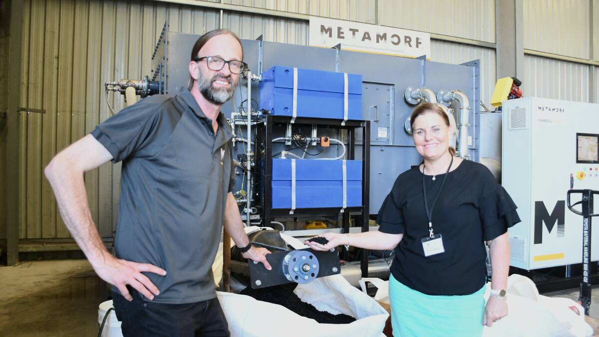 Metamorf Engineering managing director Steven Hill and Australia New Zealand Biochar Group chair Melissa Rebbeck with a CharCell pyrolysis unit that is used to produce biochar. Trials from Ms Rebbeck have shown biochar used as a feed additive and as a soil improver within beef and dairy enterprises has had big production benefits.