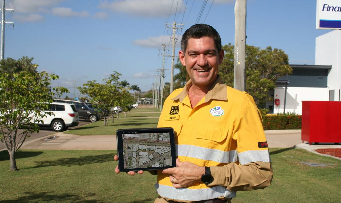 Ergon Energy Community Safety Manager Aaron Smith with the Look Up and Live app. Picture: Supplied 