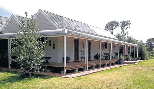 The four-bedroom homestead on “Red Hill” has and an open plan living and dining area and a wide verandah.