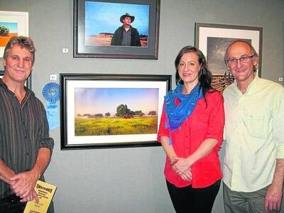 Michael Schurmann, winner of the 2011 colour print, with BHP representative Ruth Kaurila and judge Peter Eastway.