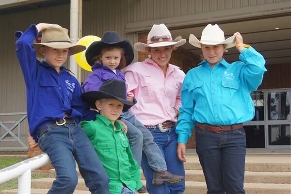 Holding onto their hats at the Toowoomba Royal Show are St George's Angus Haymes, 9, Olivia Haymes, 4, Summer Haymes, 11, Brooke Grieve, 15, Toogoolawah, and front, Hunter Haymes, 7, St George, who were showing cattle at the show for RiverRun Charolais, Linville.