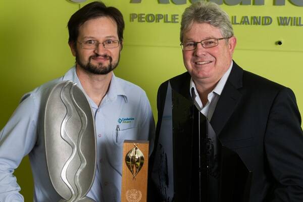 Carl Mitchell, Manager Water and Phil McCullough, CEO with the United National World Environment Day trophy, Riverprize trophy and Banksia Award trophy.