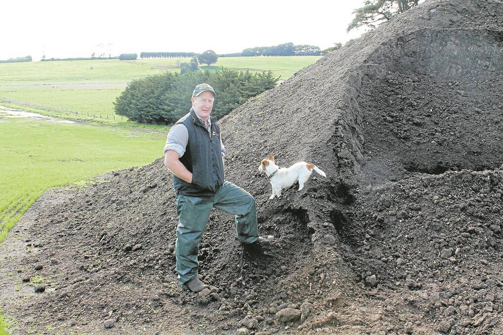 Craig Davis with some of the compost made on his farm that has improved soil and pastures.