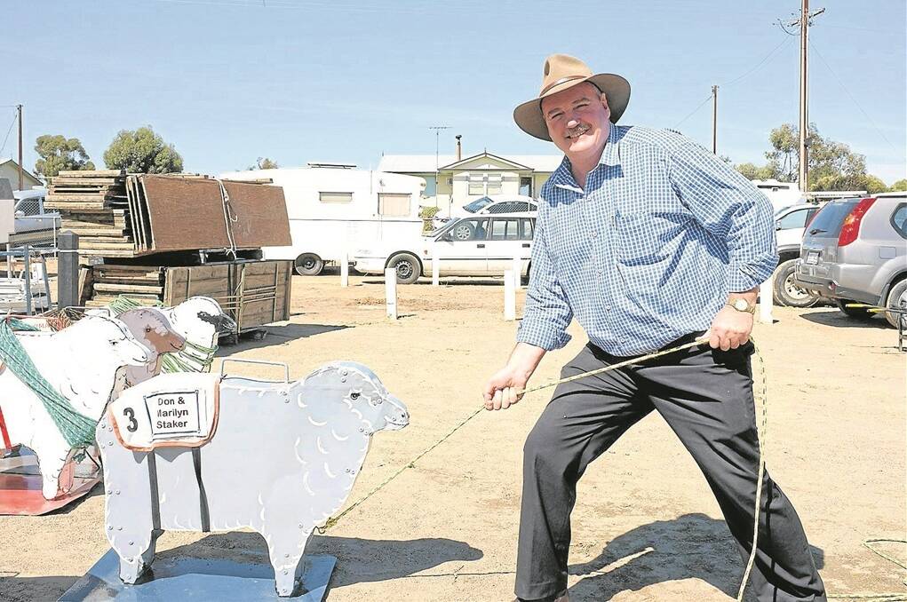 ON TRACK: Member for Hammond Adrian Pederick getting competitive at the inaugural Karoonda Cup in 2012. He ended up winning his heat, which was pulling a wooden sheep along a 30-metre track.