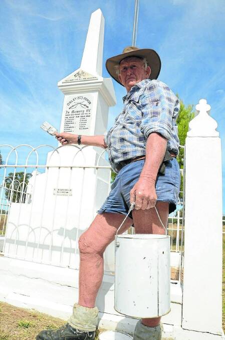 Michael Antrobus gives the Obley War Memorial a paint touch-up in readiness for Anzac Day.