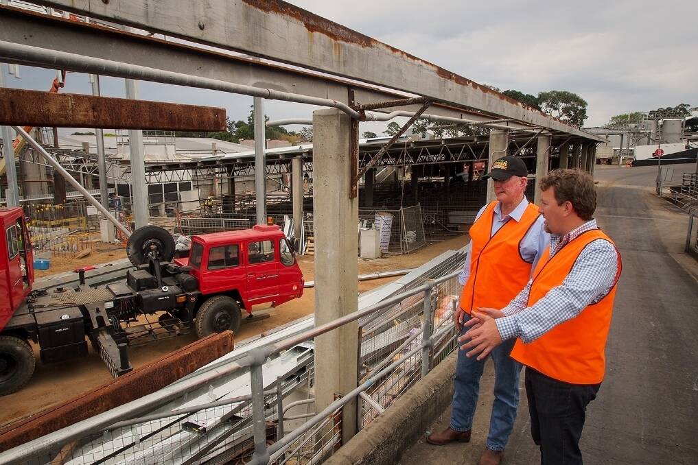 Northern Co-operative Meat Company chairman John Seccombe and chief executive Simon Stahl look over construction of the new $7 million knock-box, designed using the principles advocated by animal welfare expert Temple Grandin.