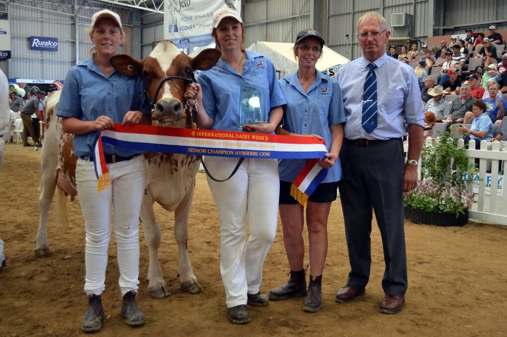 Brittany, Caitlin and Cheryl Liebich with the supreme Ayrshire cow Cher-Bar Rippa Lasselle and judge Max Hyland.