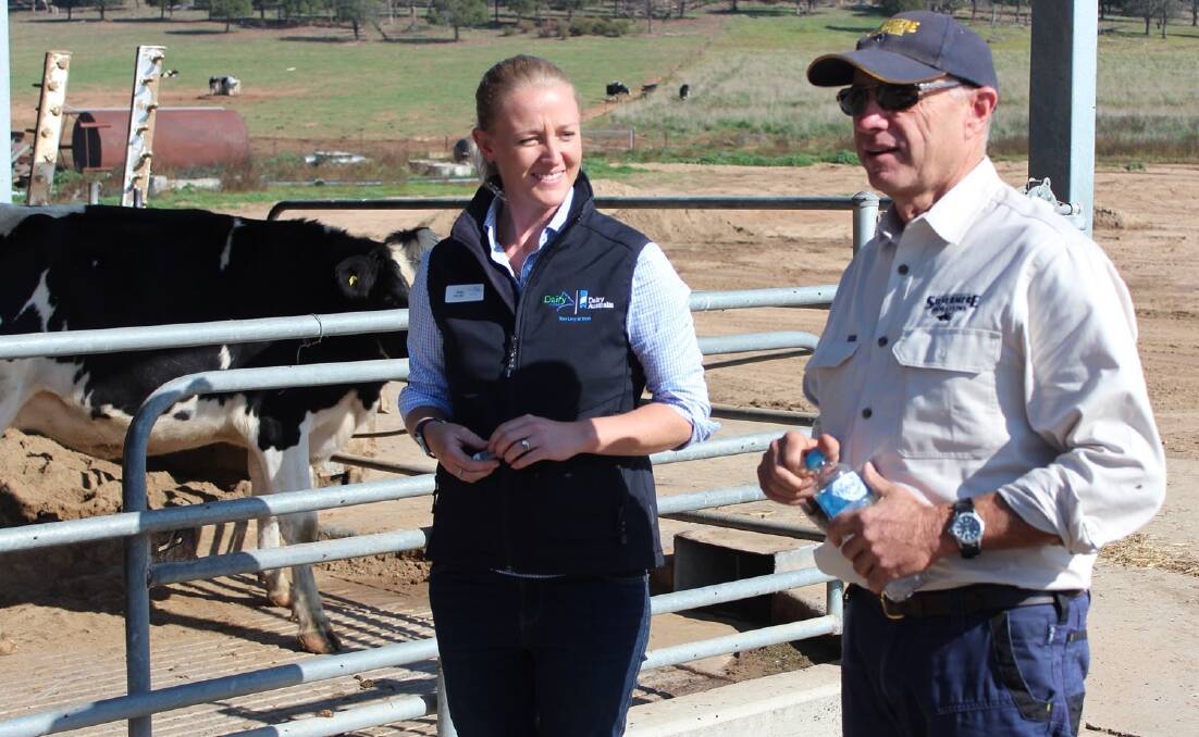Cowra dairy farmer Colin Thompson (right) is being forced to dump his milk. File photo