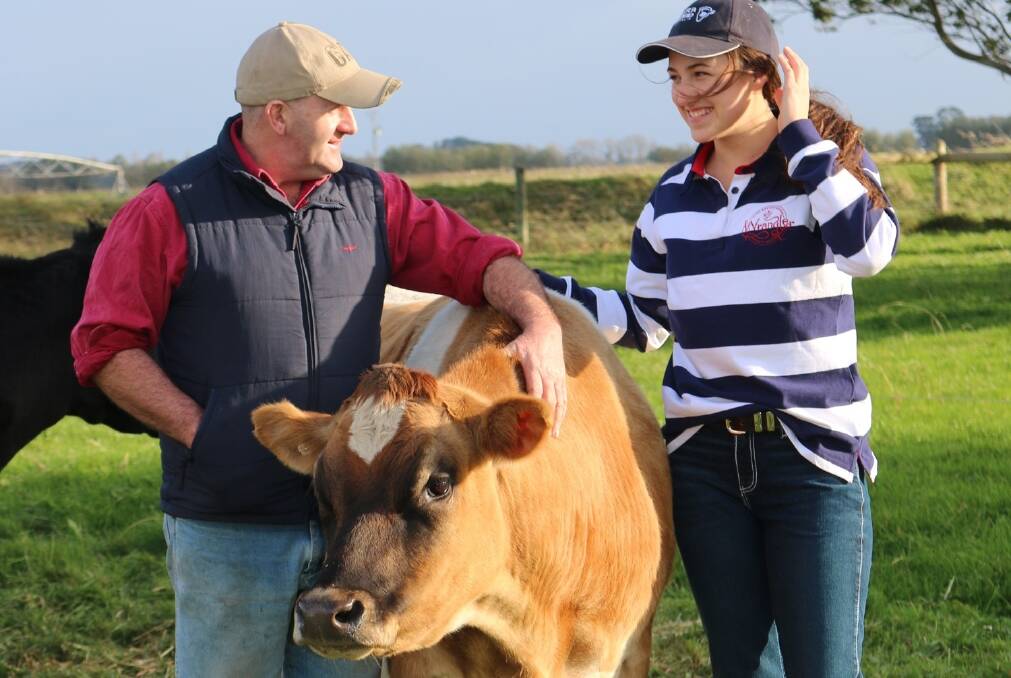 Matt and Maya Coleman with one of the Jersey cows that has been producing award-winning milk.
