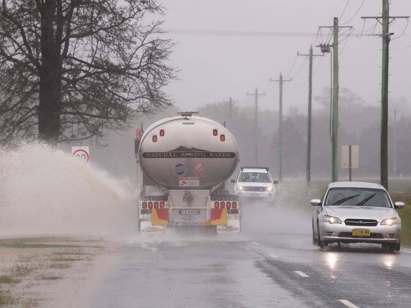 Three rainfall systems are expected to drench large parts of NSW, which are already waterlogged. (JASON O'BRIEN/AAP PHOTOS)