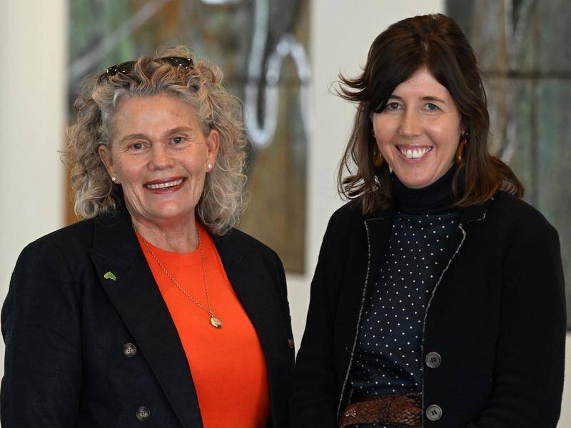 NFF president Fiona Simson, left, and agricultural economist Skye Ward catch up in Canberra. (Mick Tsikas/AAP PHOTOS)