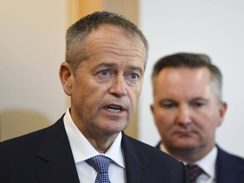 Bill Shorten (L) says climate change action will help the economy grow in the next decade.