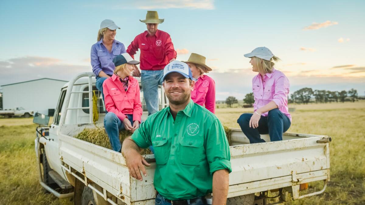 NEXT GEN'S B&S REVIVAL: Mick Hanson, Coorumbene, Taroom, stands before fellow Taroom committee members Lucy and Jane Ziesemer, Beaumont, Taroom (purple and pink), brother and sister Scott and Alicia Hawkins (red and pink), and Scott's partner Kristy Zancola (peach), all from Speculation, Taroom. Photo - Kelly Butterworth. 