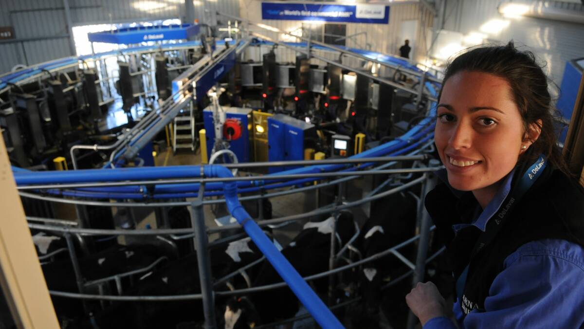 MECHANIC HELP: Rebekah Dornauf with Dornauf Gala Farm's robotic rotary or automatic milking rotary system. Picture: file