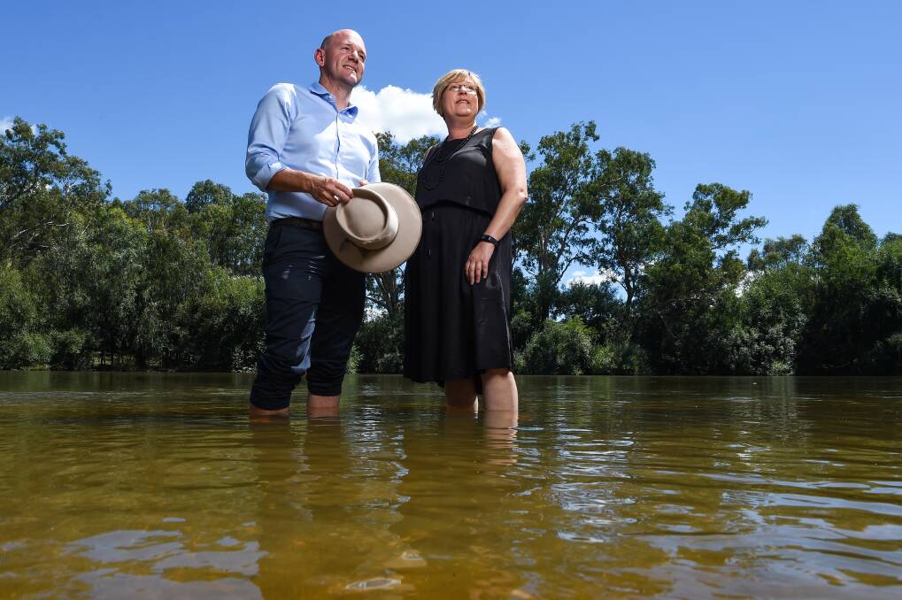 NSW Water Minister Niall Blair and Victorian Water Minister Lisa Neville in the Murray River at Albury. Picture: MARK JESSER
