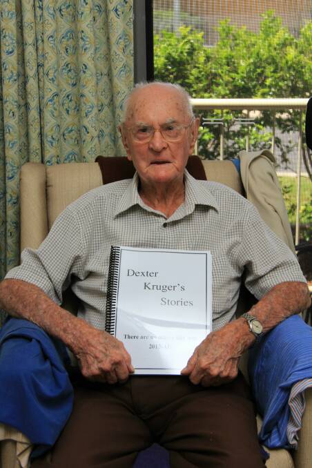 Dexter Kruger celebrated his 107th birthday on January 13. He is pictured with one of the many books he has published about his life. 